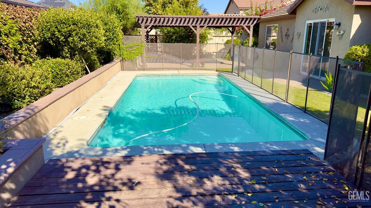 Undisclosed Address Bakersfield, CA 93311 - Photo 27 of 48 a view of a swimming pool with a patio