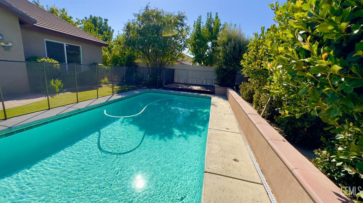 Undisclosed Address Bakersfield, CA 93311 - Photo 28 of 48 a view of swimming pool in a backyard