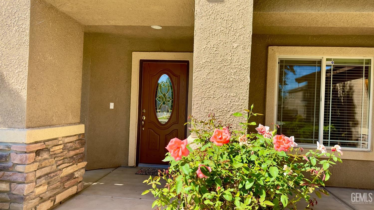 Undisclosed Address Bakersfield, CA 93311 - Photo 48 of 48 a front view of a house with flowers