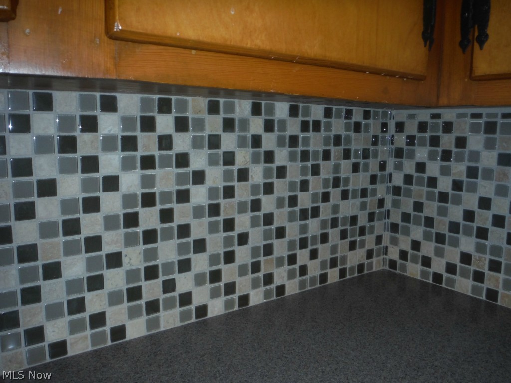 140 Far View Road Southwest North Canton, OH 44720 - Photo 6 of 25 Updated Glass tile back splash and solid surface counter top