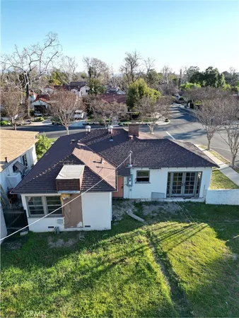 an aerial view of a house with a garden