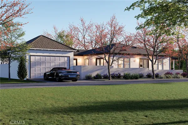 a car parked in front of a house with a big yard