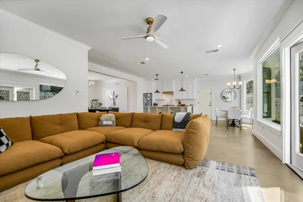 a close view of a sink a mirror and a potted plant