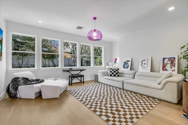 a bedroom with bed and window