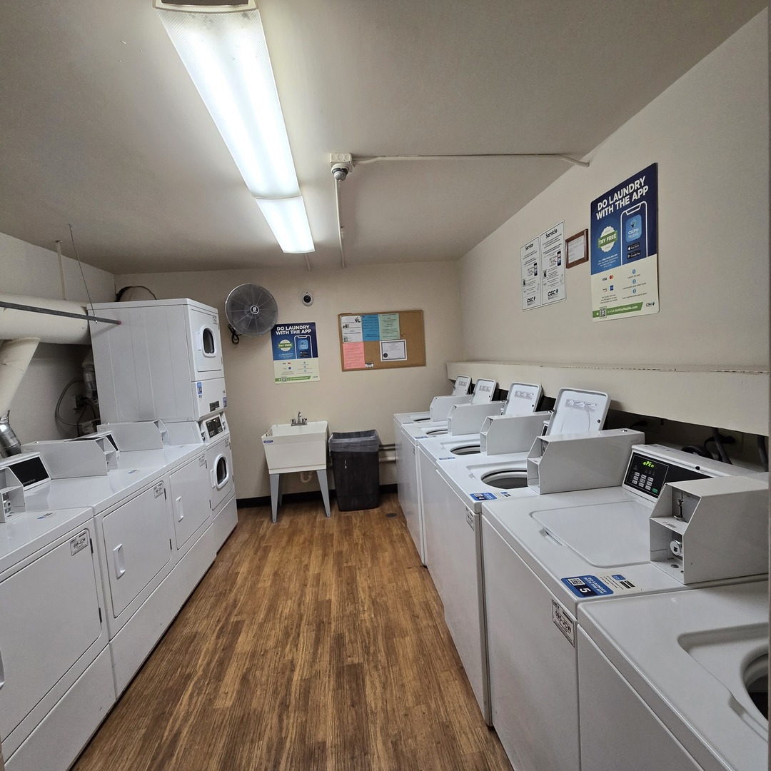 1500 Robin Circle, Unit 101 Hoffman Estates, IL 60169 - Photo 13 of 20 a view of a kitchen with a sink and wooden floor