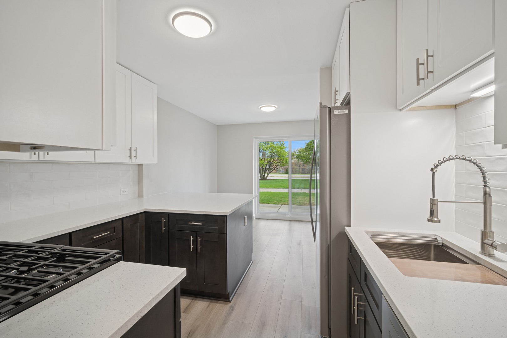 1500 Robin Circle, Unit 101 Hoffman Estates, IL 60169 - Photo 3 of 20 a kitchen with a sink a stove and cabinets