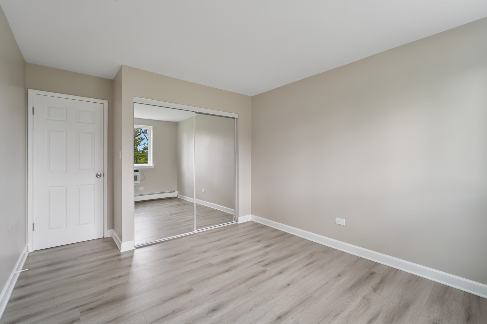 1500 Robin Circle, Unit 101 Hoffman Estates, IL 60169 - Photo 8 of 20 wooden floor in an empty room