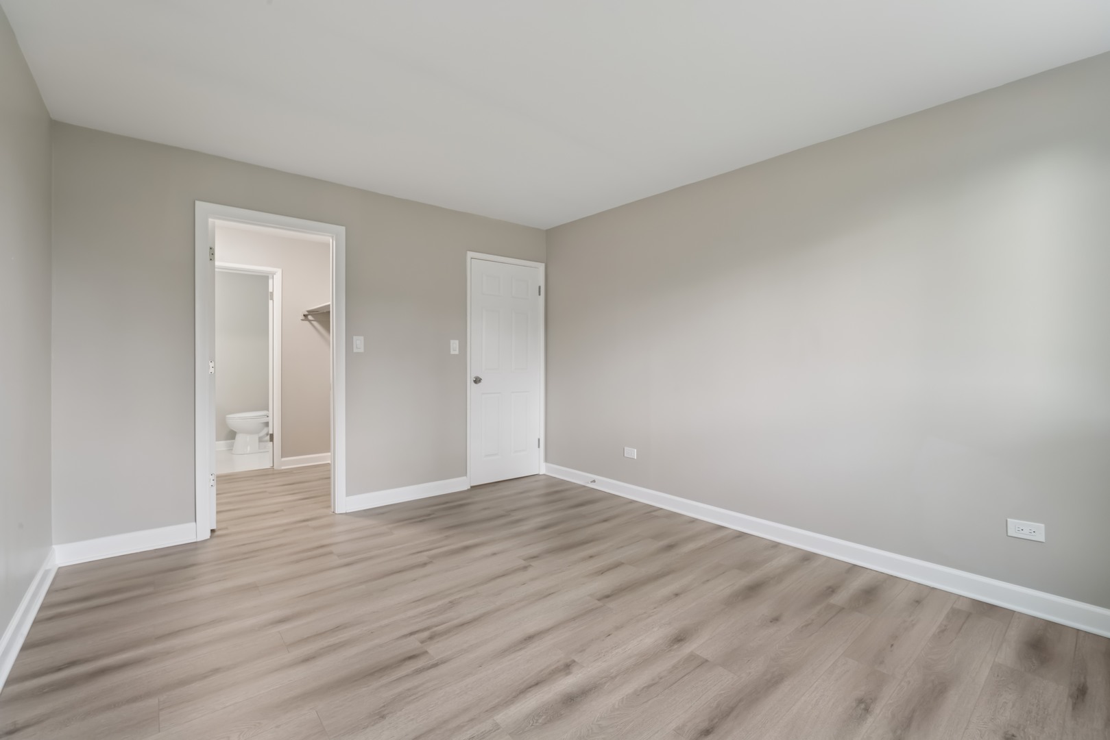 1500 Robin Circle, Unit 101 Hoffman Estates, IL 60169 - Photo 10 of 20 a view of an empty room with wooden floor and closet