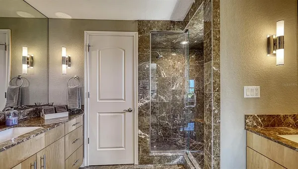 a bathroom with a shower and a sink