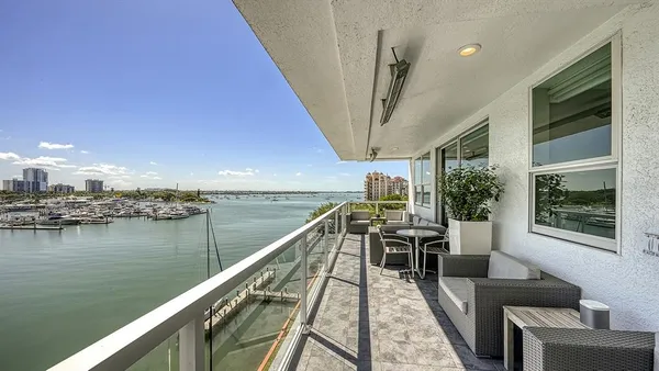 a view of a balcony with chairs