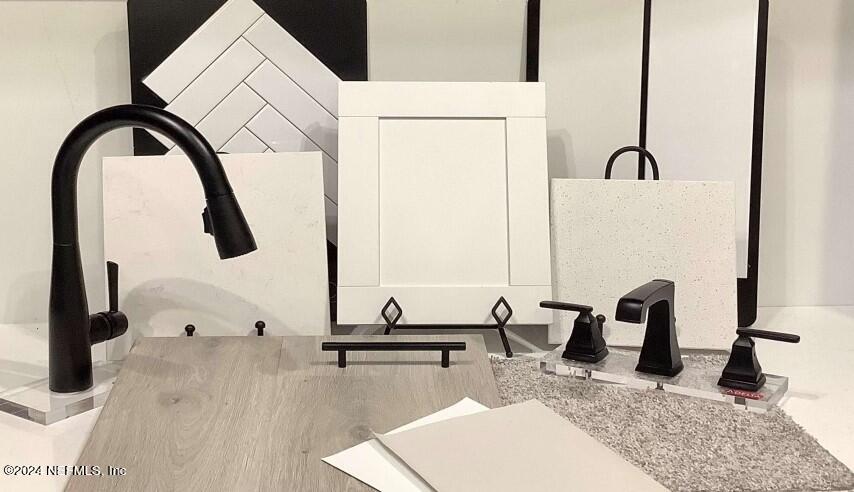 273 Honeycomb Trail St. Augustine, FL 32095 - Photo 2 of 16 a bathroom with a granite countertop sink and a mirror