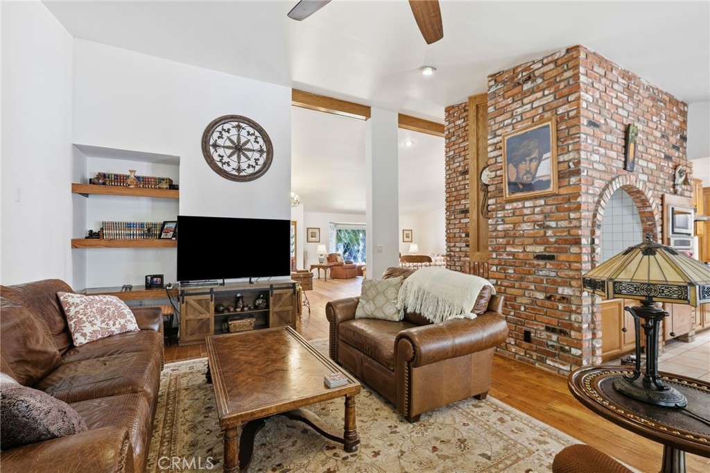 18233 Charlton Lane Porter Ranch, CA 91326 - Photo 33 of 40 a living room with furniture and a flat screen tv