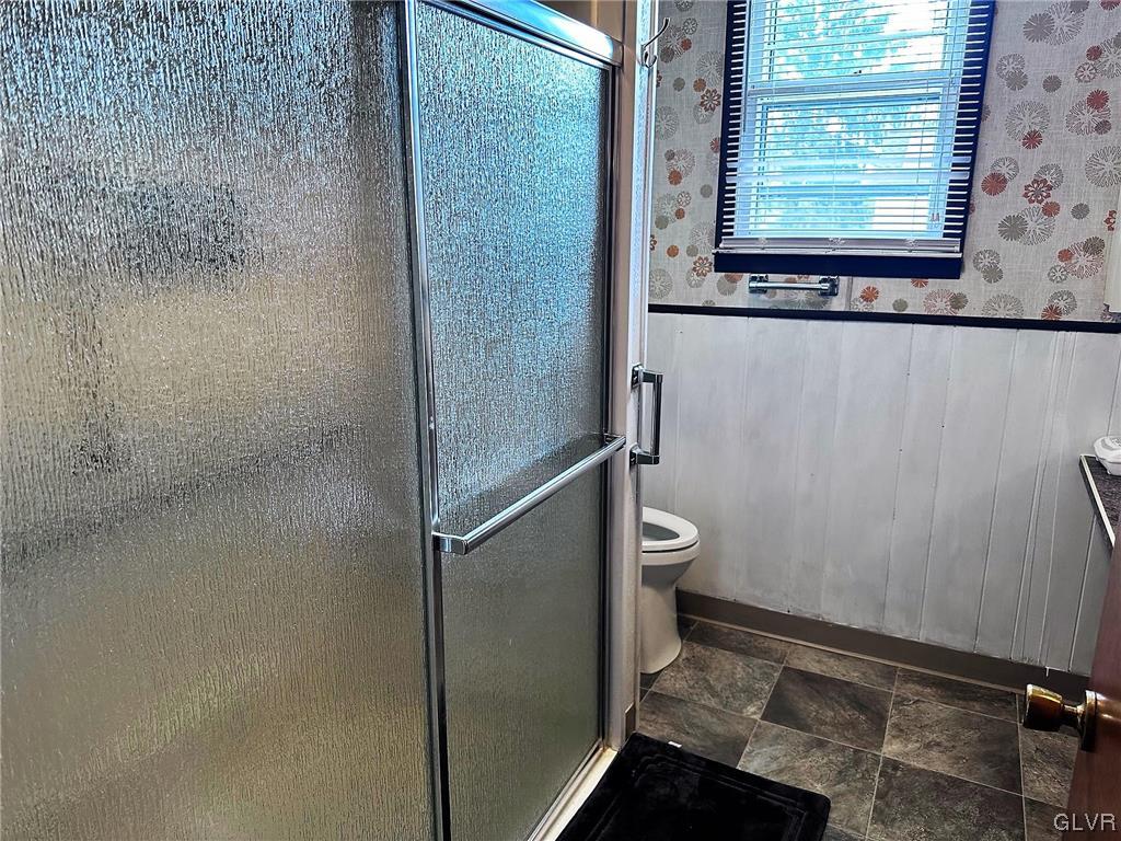 3709 Fairview Street Bethlehem, PA 18017 - Photo 13 of 35 a bathroom with a granite countertop window a toilet and a shower