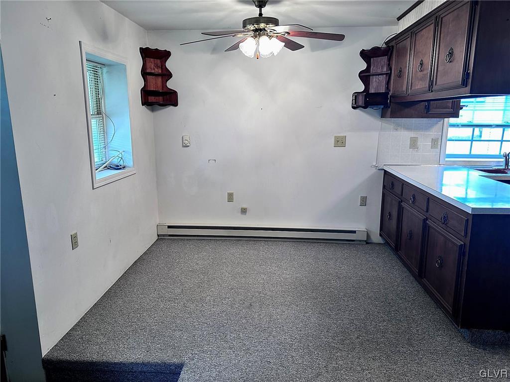3709 Fairview Street Bethlehem, PA 18017 - Photo 20 of 35 an empty room with a kitchen space a sink and dishwasher