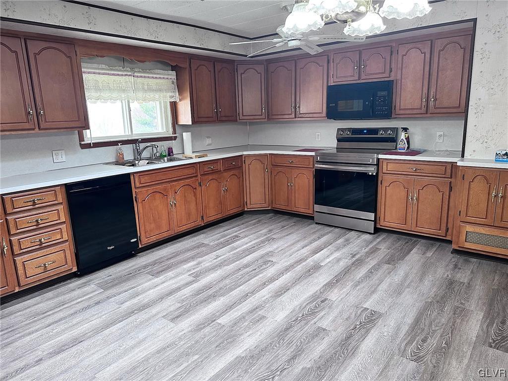 3709 Fairview Street Bethlehem, PA 18017 - Photo 4 of 35 a kitchen with stainless steel appliances granite countertop a stove a sink and a microwave