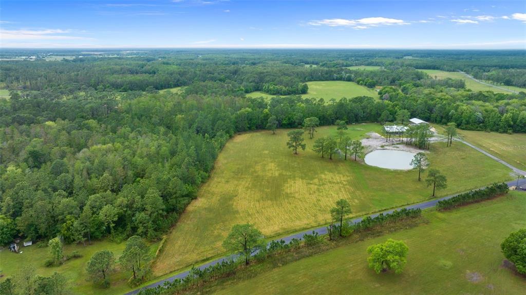 North Poyner Road Polk City, FL 33868 - Photo 1 of 1 a swimming pool with trees in the background