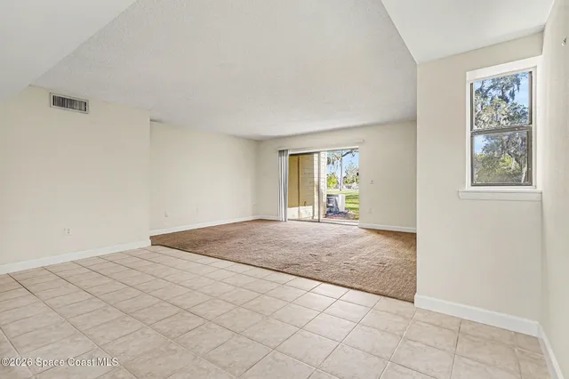 a view of an empty room and window