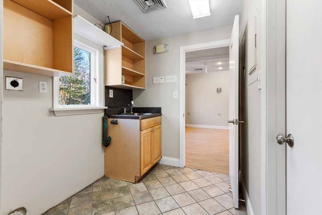 231 Bedford Street Lexington, MA 02420 - Photo 14 of 31 a view of a utility room with washer and dryer