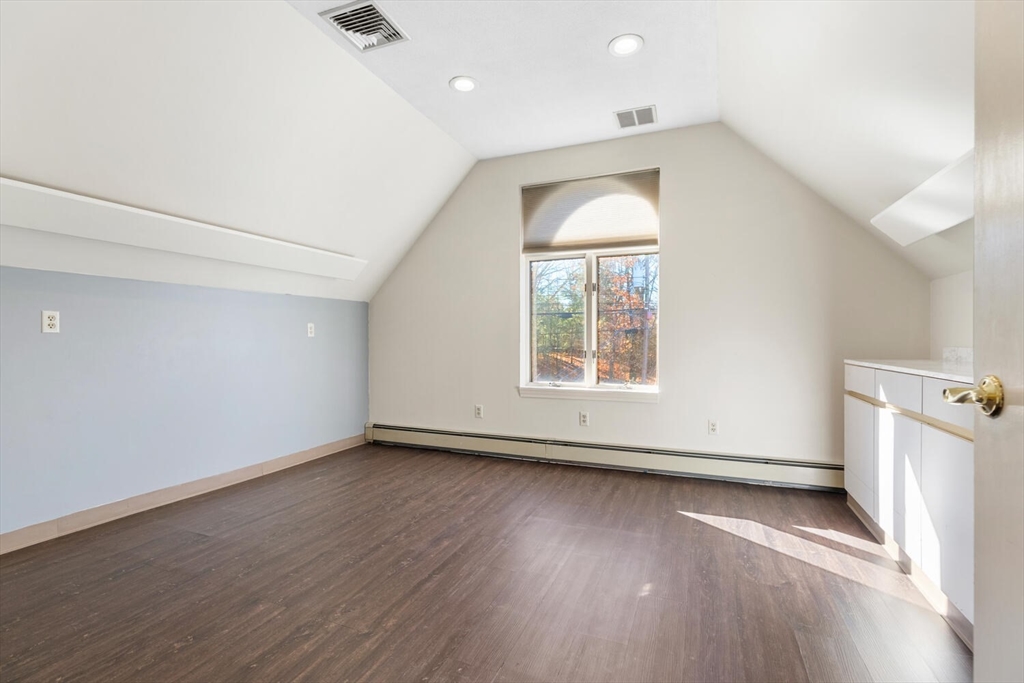 231 Bedford Street Lexington, MA 02420 - Photo 24 of 31 an empty room with wooden floor and windows