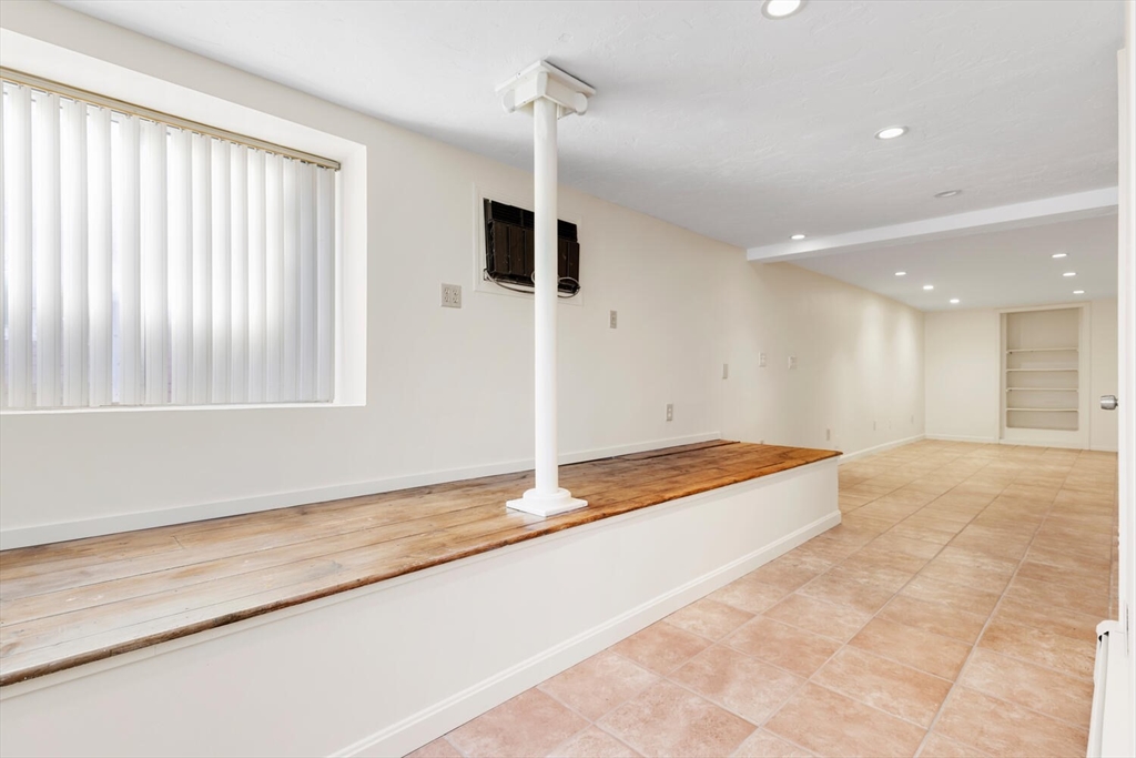 231 Bedford Street Lexington, MA 02420 - Photo 27 of 31 a view of an empty room with a window