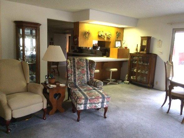 8251 North Applegate Road Grants Pass, OR 97527 - Photo 10 of 35 a living room with furniture and a fireplace