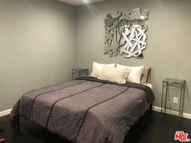 a bedroom with a bed and a table