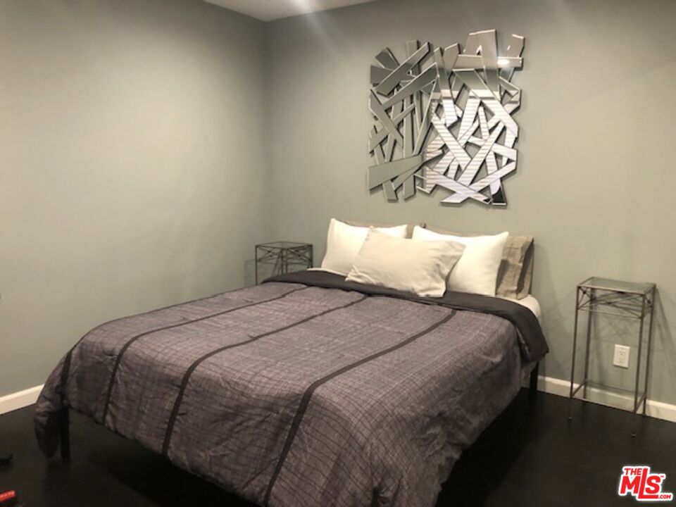 8300 Manitoba Street, Unit 209 Playa del Rey, CA 90293 - Photo 12 of 22 a bedroom with a bed and a table