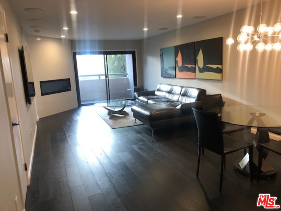 8300 Manitoba Street, Unit 209 Playa del Rey, CA 90293 - Photo 16 of 22 a living room with furniture window and wooden floor