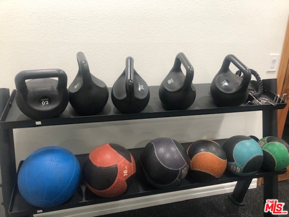 8300 Manitoba Street, Unit 209 Playa del Rey, CA 90293 - Photo 18 of 22 a living room with chairs and a table