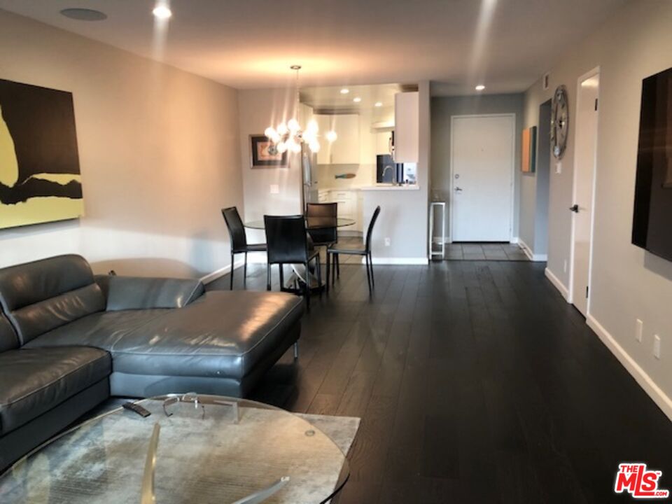 8300 Manitoba Street, Unit 209 Playa del Rey, CA 90293 - Photo 4 of 22 a living room with furniture and a flat screen tv
