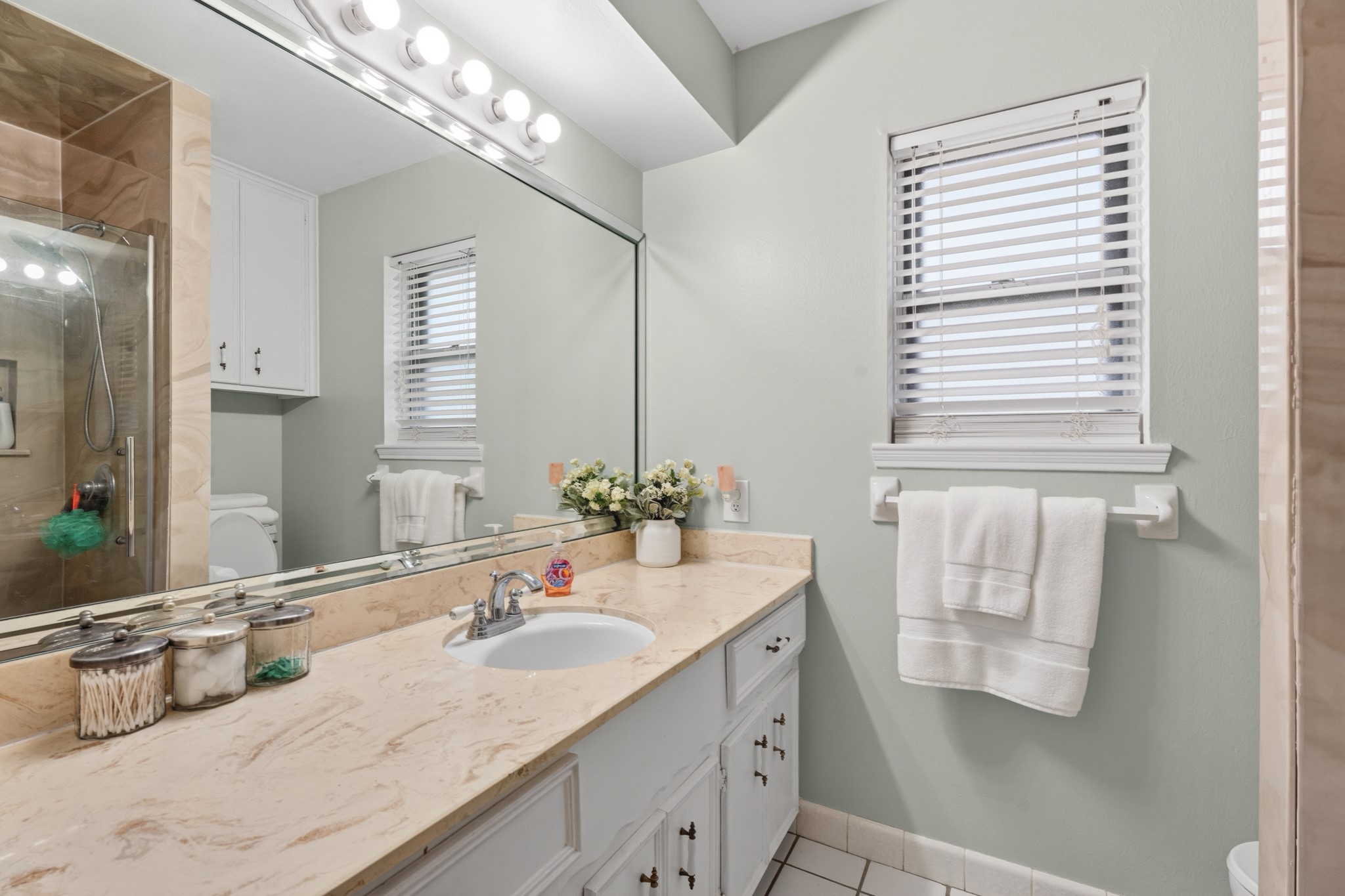 2104 Rose Road Pearland, TX 77581 - Photo 39 of 43 a bathroom with a granite countertop sink and a mirror