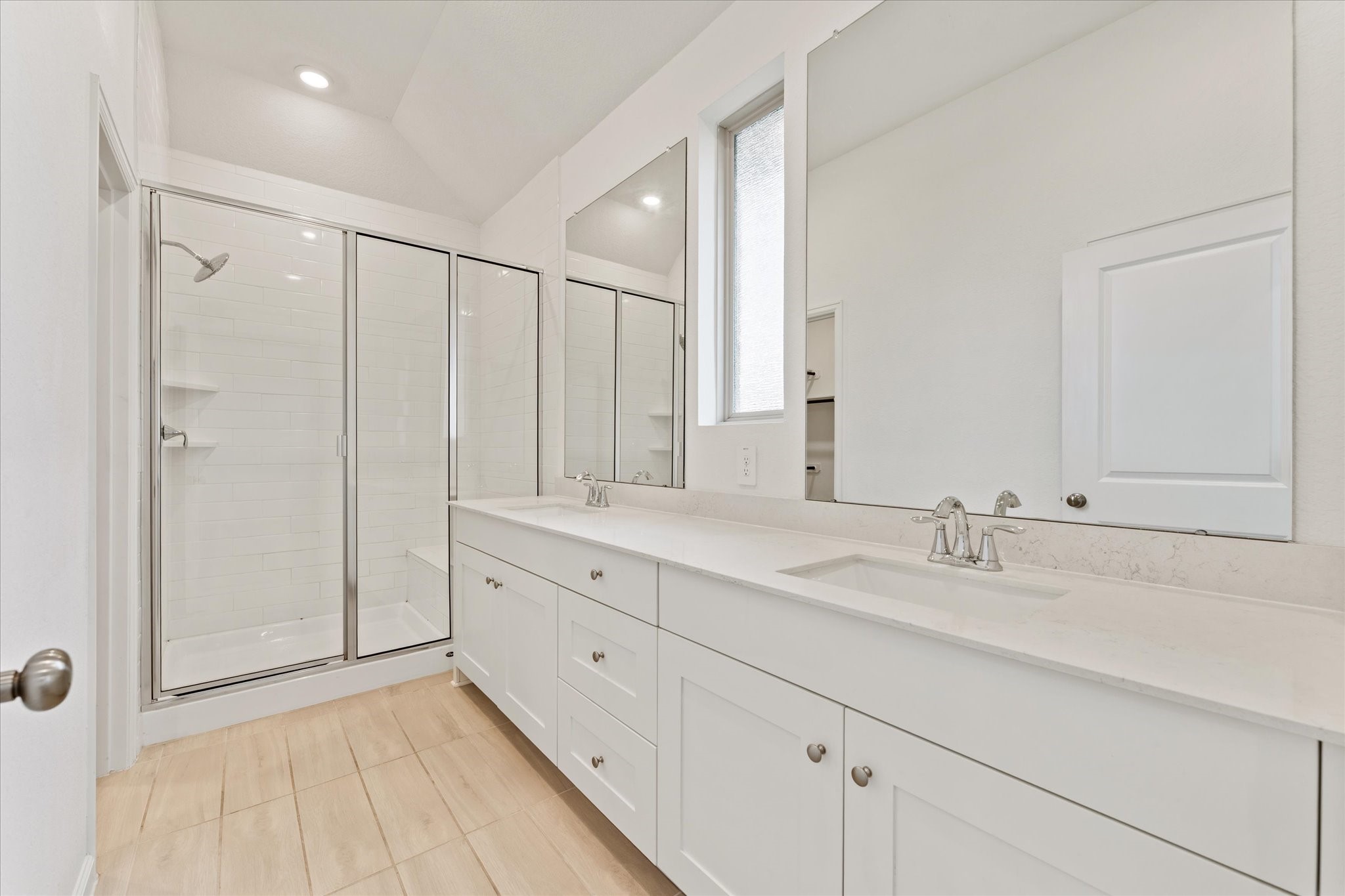 15520 Sunset Maple Court Conroe, TX 77302 - Photo 17 of 46 a bathroom with a double vanity sink and mirror