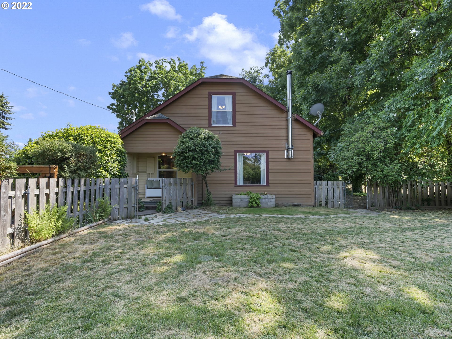 1689 Southwest Stringtown Road Forest Grove, OR 97116 - Photo 1 of 28 a house is sitting in middle of the green field