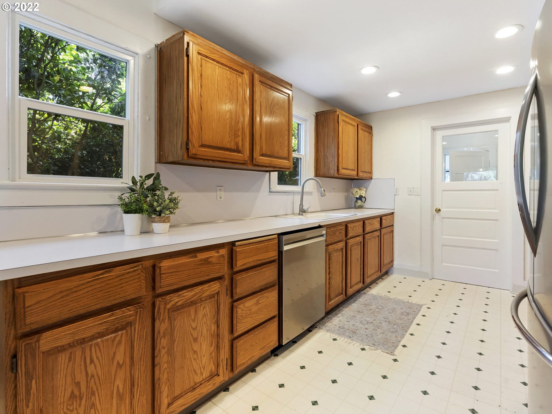 1689 Southwest Stringtown Road Forest Grove, OR 97116 - Photo 12 of 28 a kitchen with a sink a window and cabinets