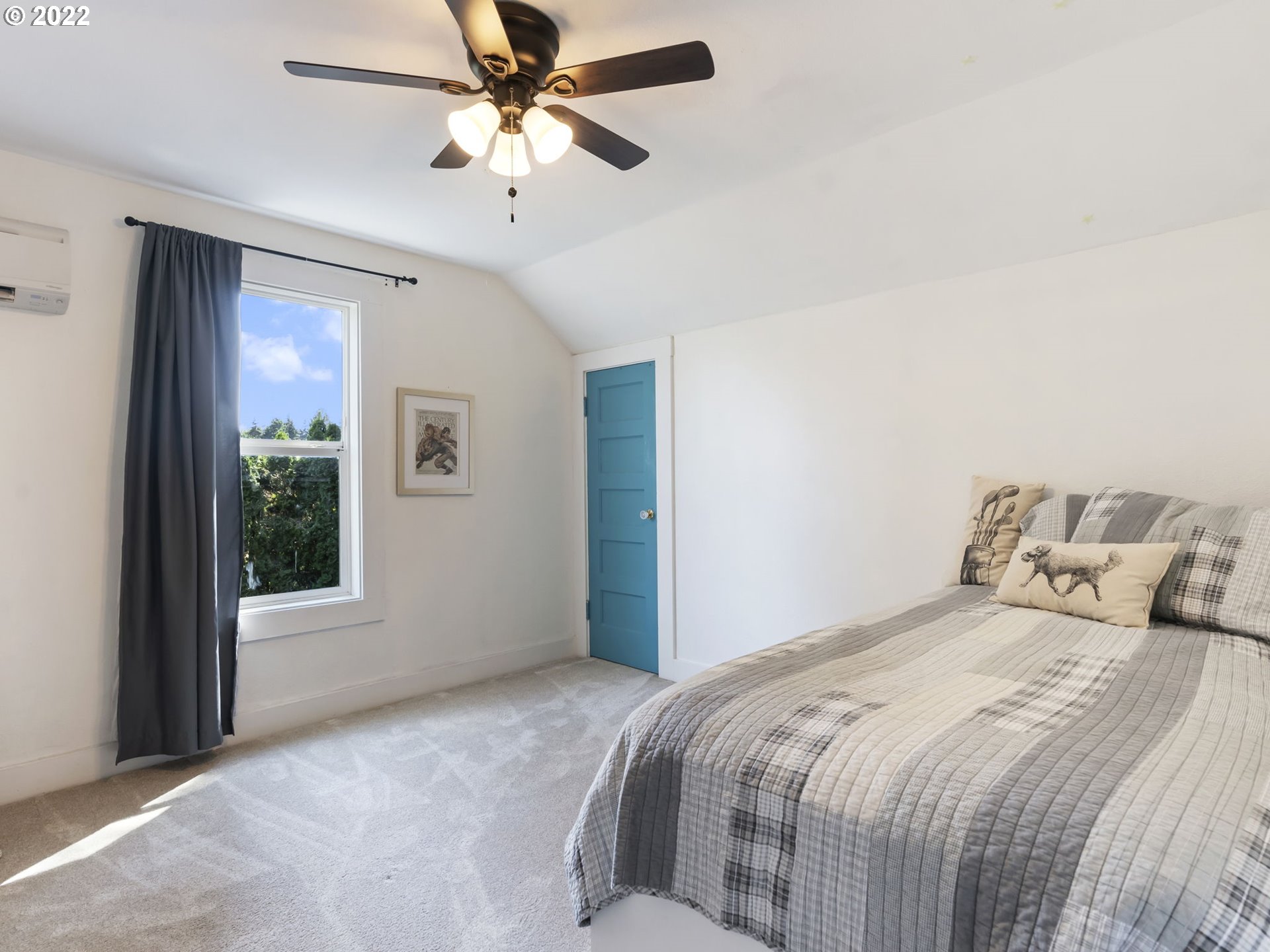 1689 Southwest Stringtown Road Forest Grove, OR 97116 - Photo 23 of 28 a bedroom with a large bed and a large window