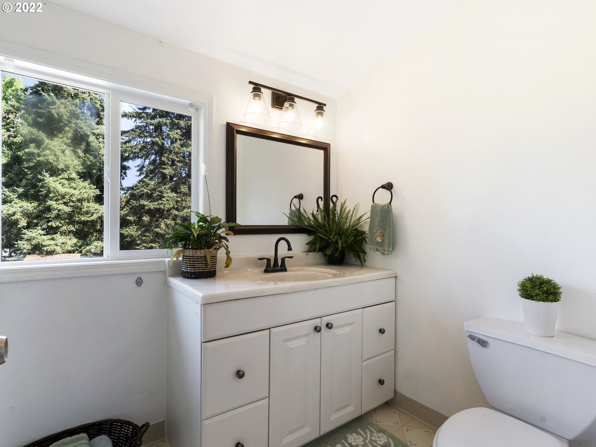 1689 Southwest Stringtown Road Forest Grove, OR 97116 - Photo 24 of 28 a bathroom with a toilet sink and mirror
