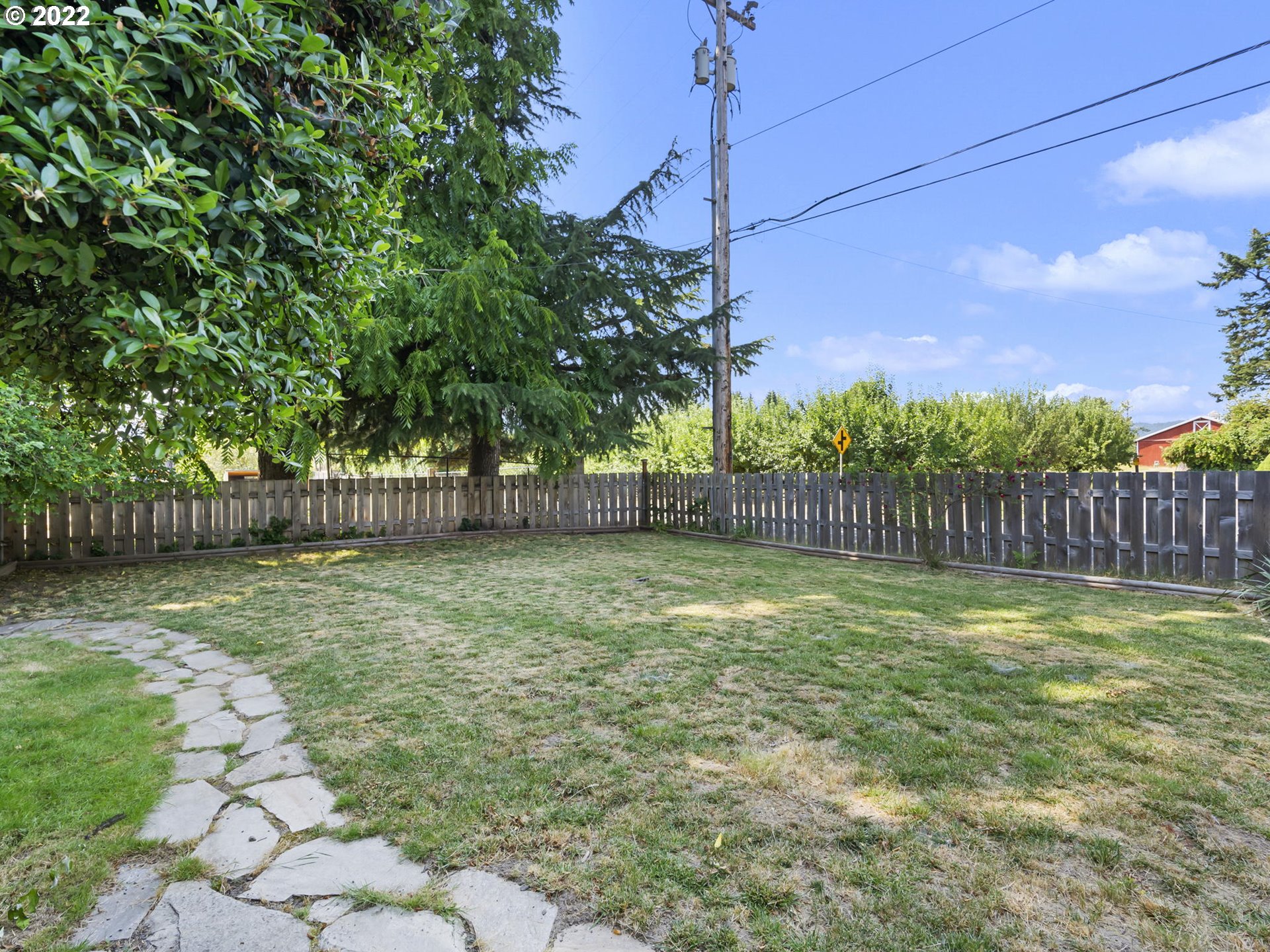 1689 Southwest Stringtown Road Forest Grove, OR 97116 - Photo 26 of 28 a view of a yard with a fence