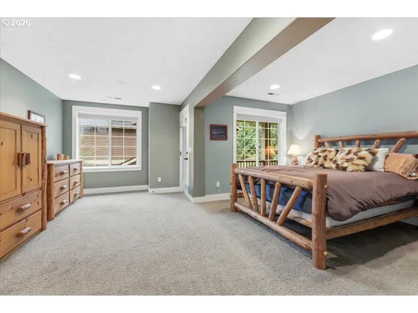 a bed room with a bed and a window