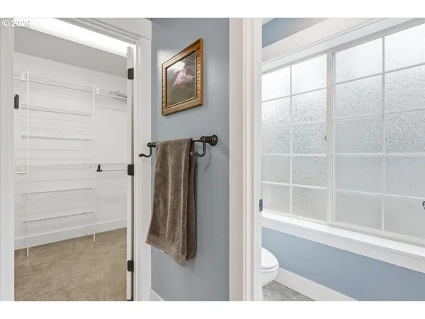 a bathroom with a shower and a glass door