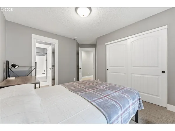 a bedroom with a bed and closet