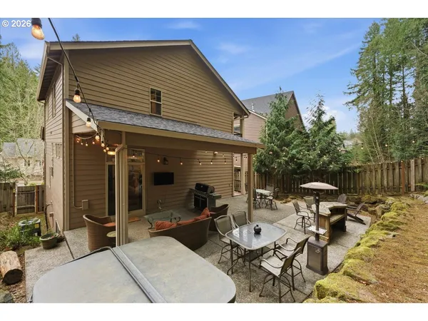 a outdoor living space with furniture potted plant and a view of kitchen