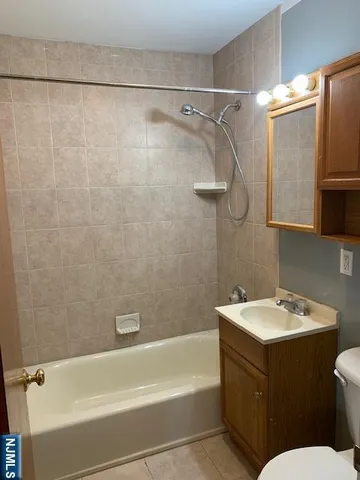 a bathroom with a sink a toilet and a bathtub