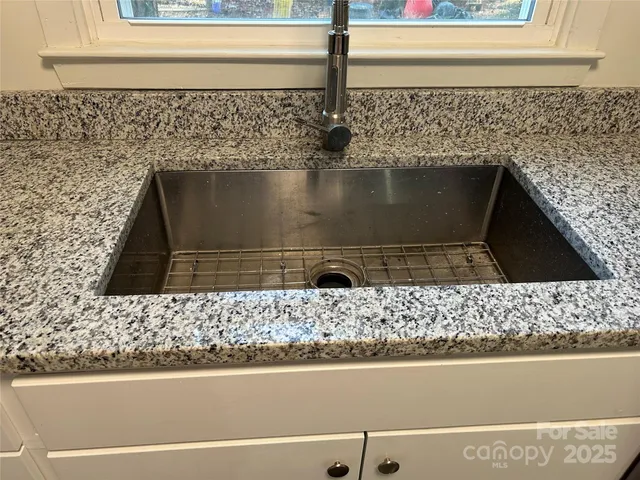 a view of fireplace and window