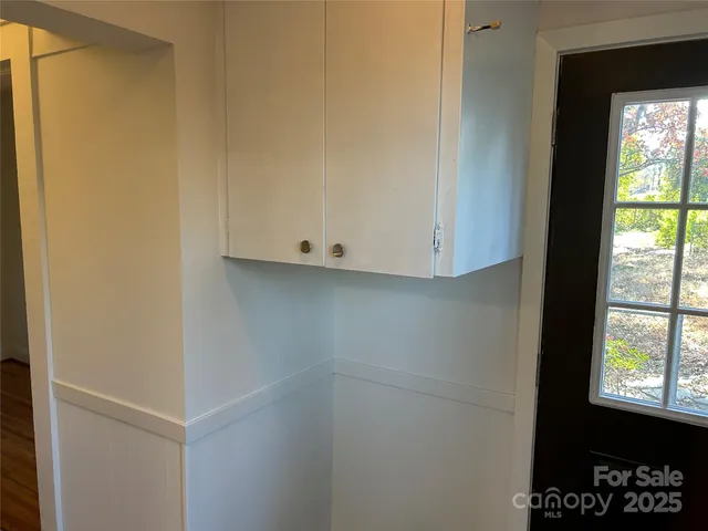 a view of an empty room and a window