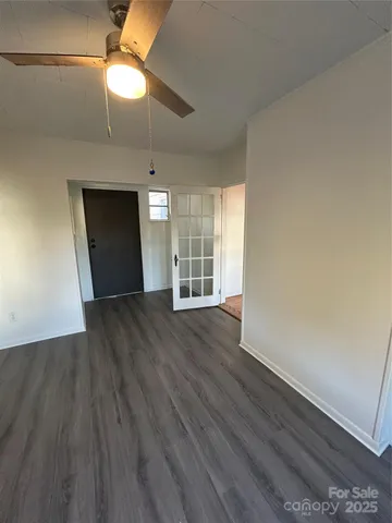 a view of walk in closet with empty racks