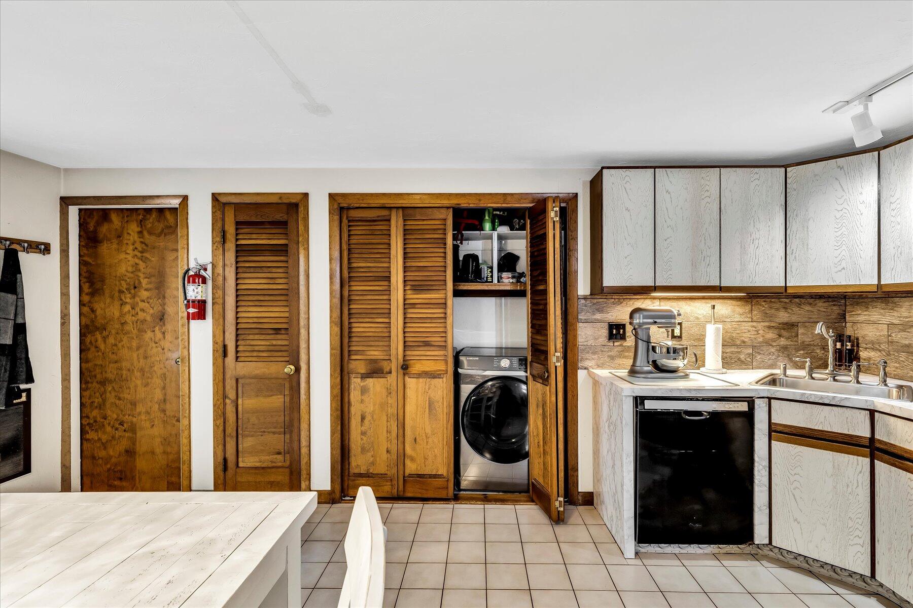 1007 River Road Marstons Mills, MA 02648 - Photo 14 of 33 a kitchen with a sink a stove and cabinets