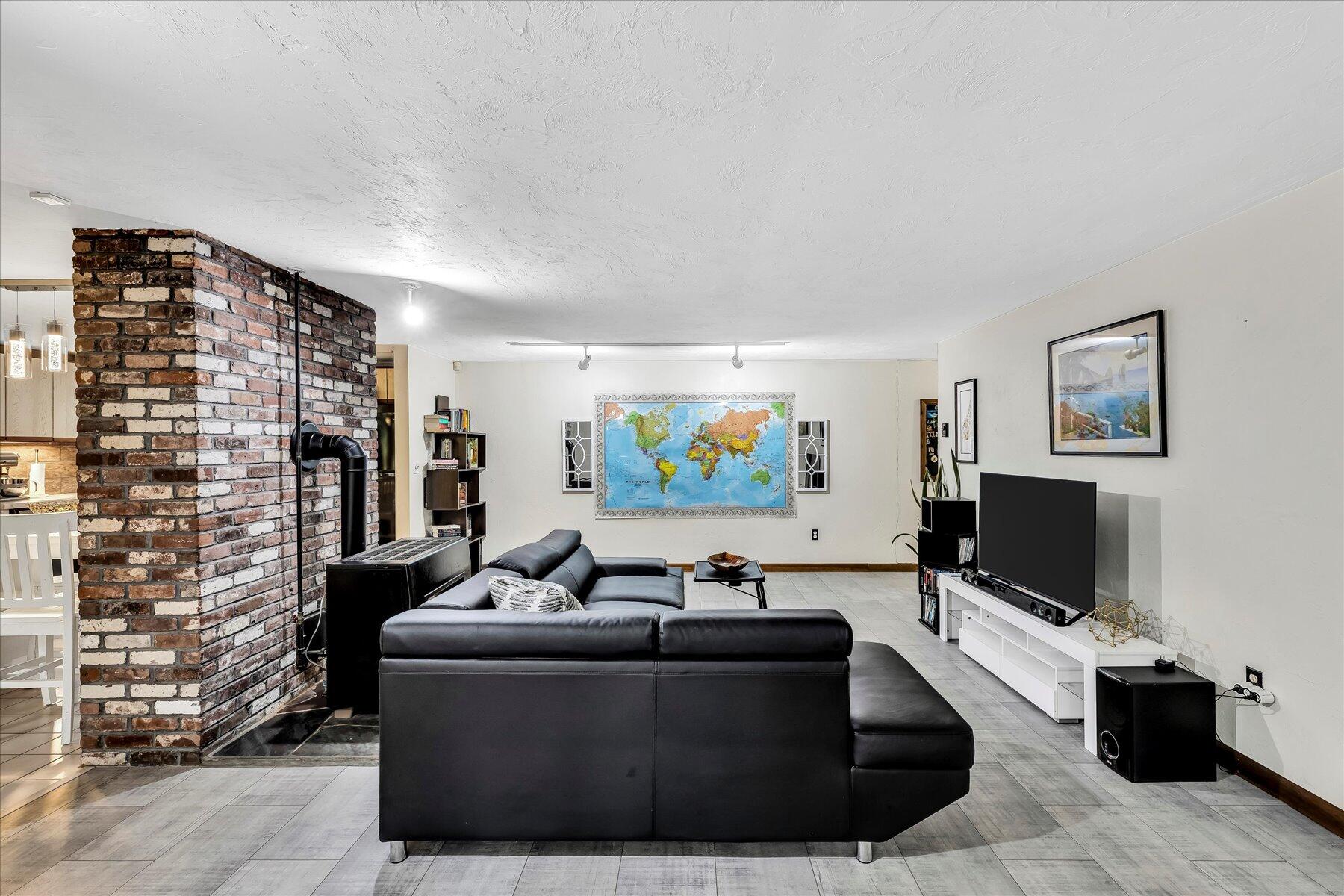 1007 River Road Marstons Mills, MA 02648 - Photo 15 of 33 a living room with furniture and a flat screen tv