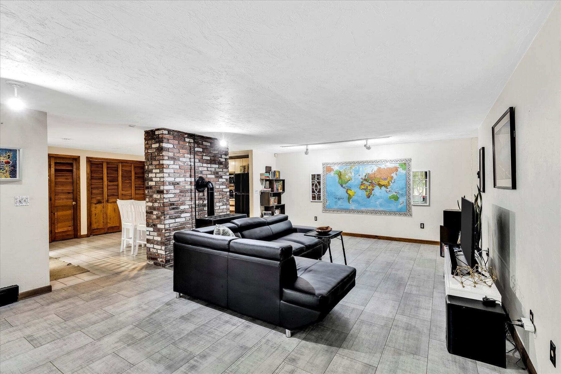 1007 River Road Marstons Mills, MA 02648 - Photo 16 of 33 a living room with furniture and a flat screen tv