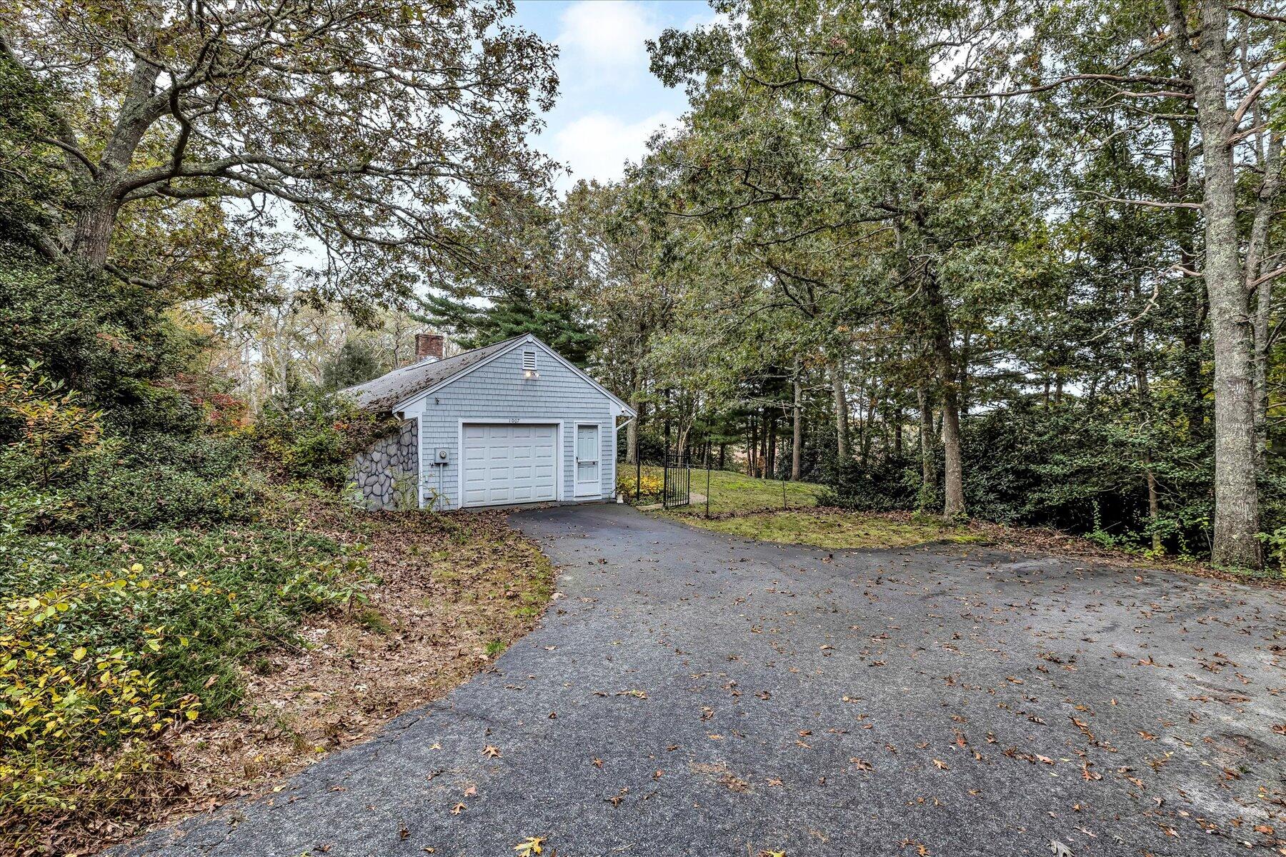 1007 River Road Marstons Mills, MA 02648 - Photo 2 of 33 a view of a house with large trees