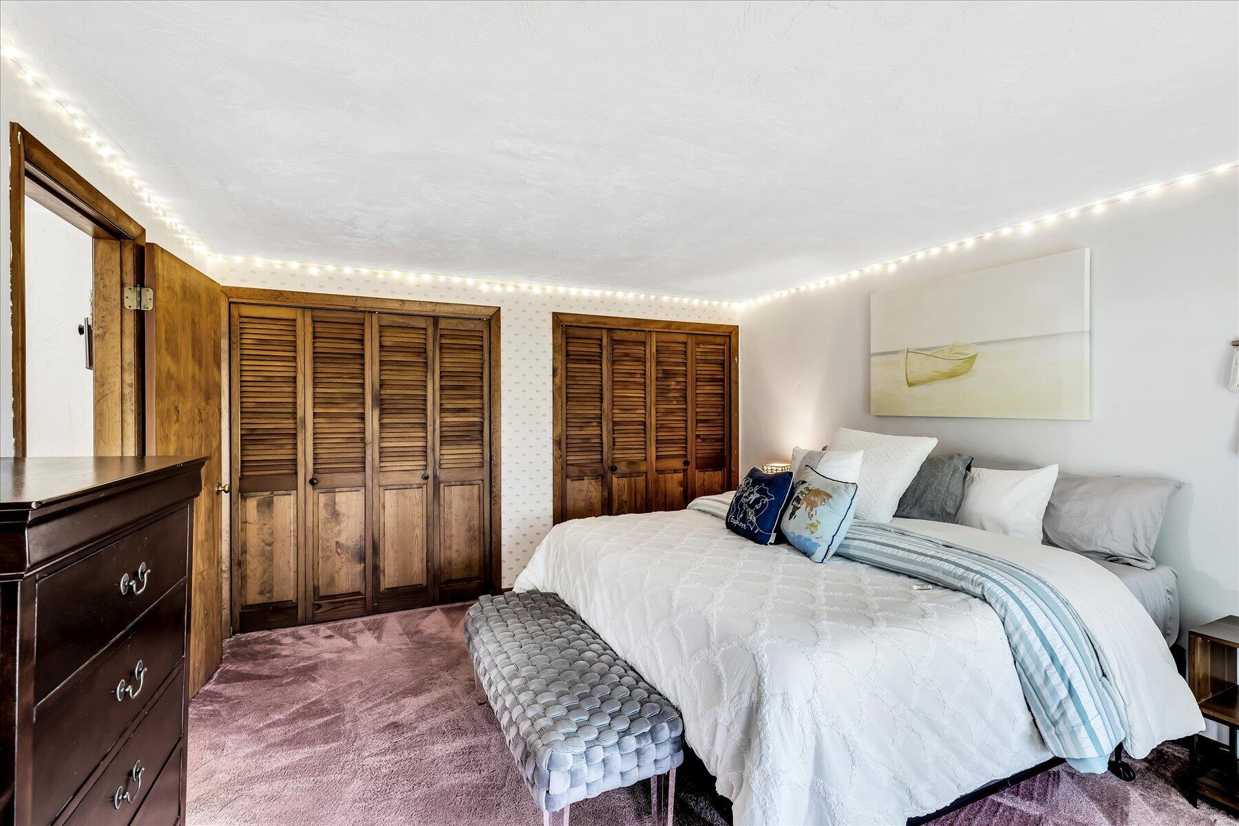 1007 River Road Marstons Mills, MA 02648 - Photo 29 of 33 a bedroom with a bed and wooden floor